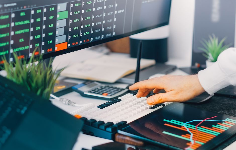Trading charts and market data displayed across a professional finance workstation