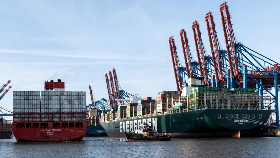 Container ships at a commercial port as geopolitical risk raises energy and freight costs
