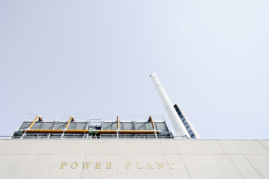 A power plant represents the electricity and resilience requirements behind the capital-intensive AI buildout.