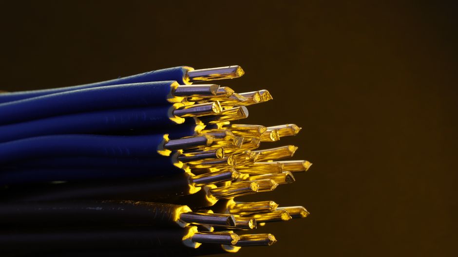 Blue network cables and exposed conductors representing cloud infrastructure capacity