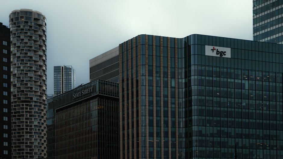 Modern financial district skyline with glass skyscrapers at dusk