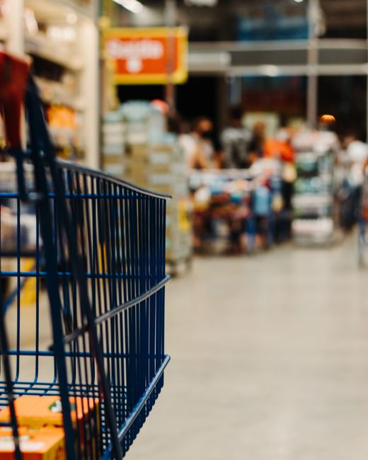Shopping cart in a supermarket aisle