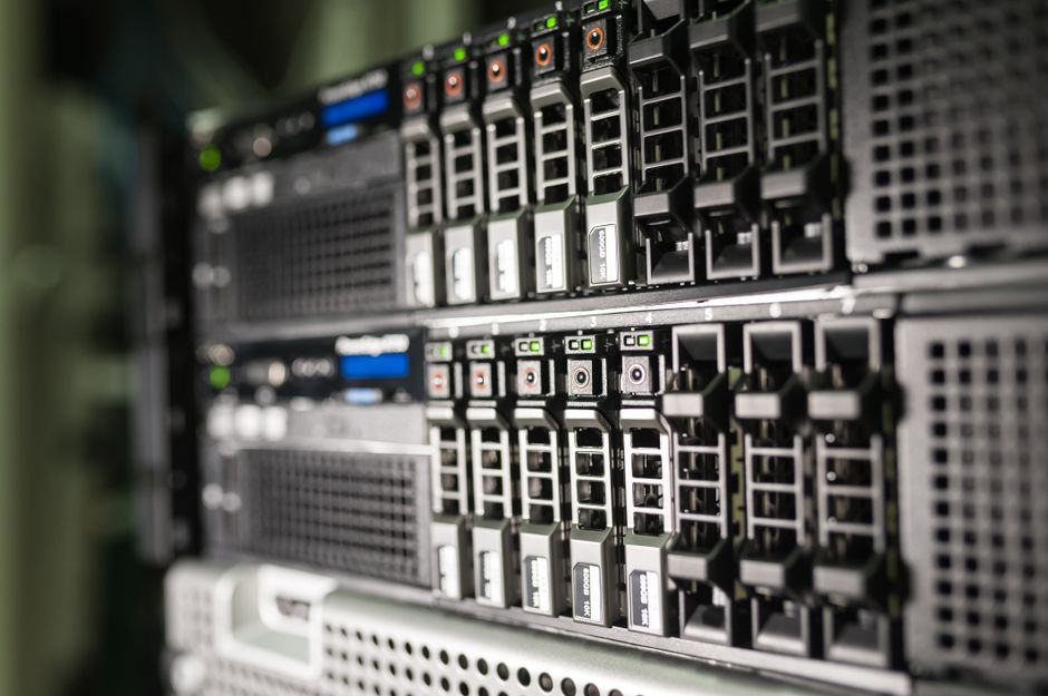 Rows of server racks and cabling inside a data center