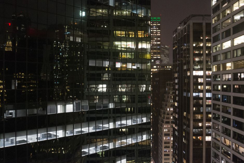 Illuminated skyscrapers at night in downtown New York City