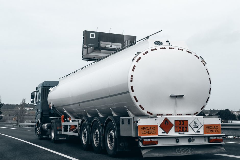 A tanker truck transporting fuel on a highway, representing the diesel and refined product supply chain under strain