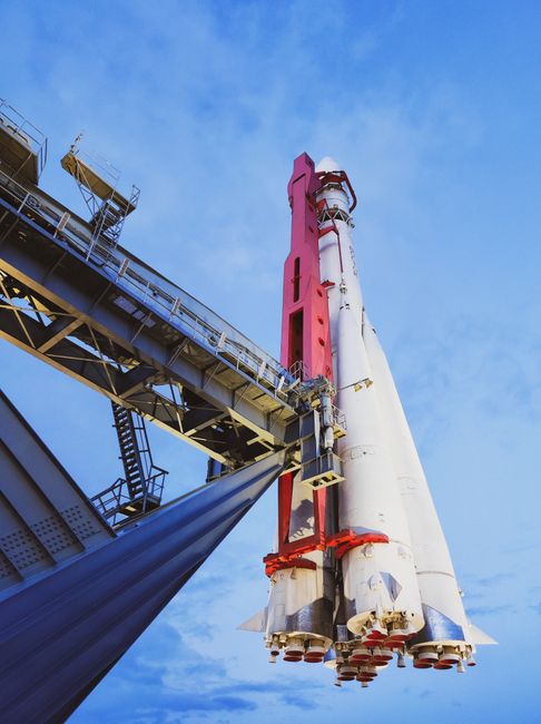 Space rocket on launch pad against blue sky