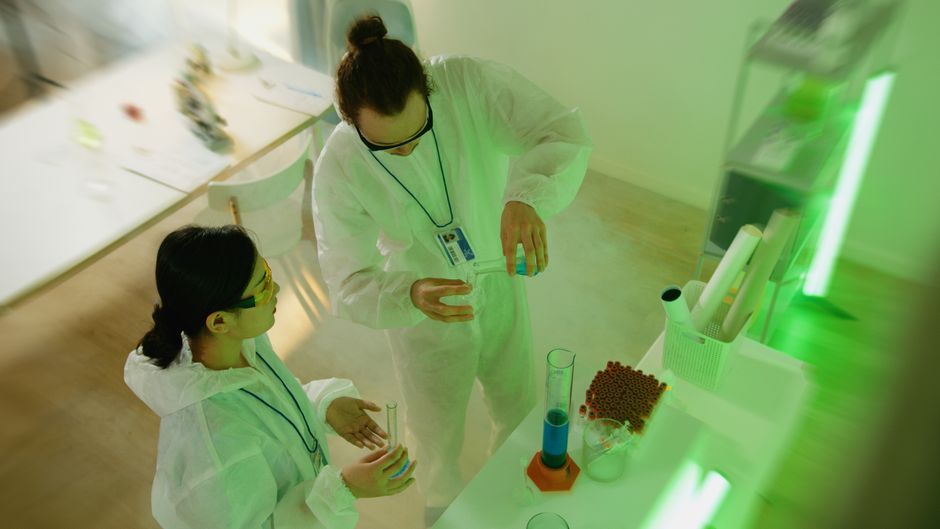 Biotechnology laboratory researchers conducting experiments