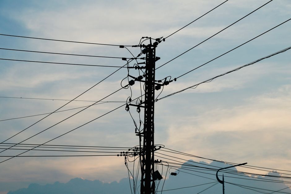 Power transmission lines underscore the electricity, permitting and capital needed to expand AI data-center capacity.