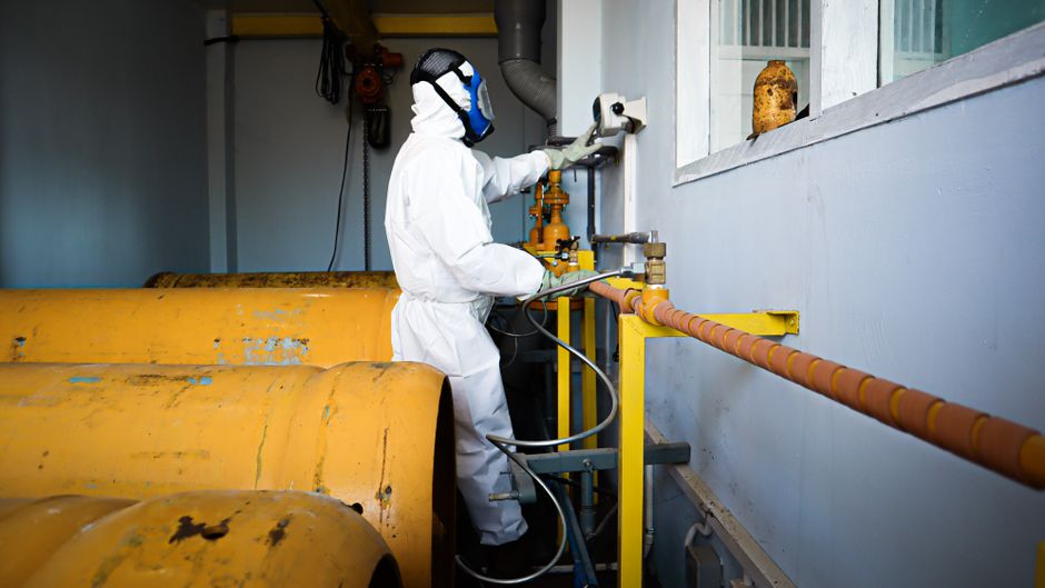 Technician inspecting industrial cooling infrastructure