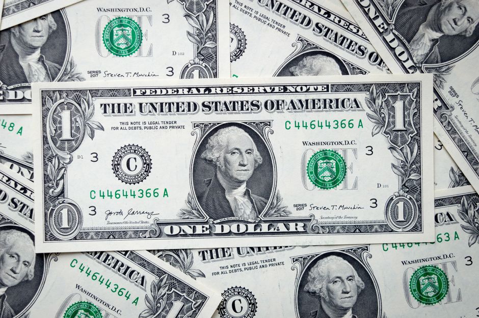 Dollar bills representing the cost of capital in the market