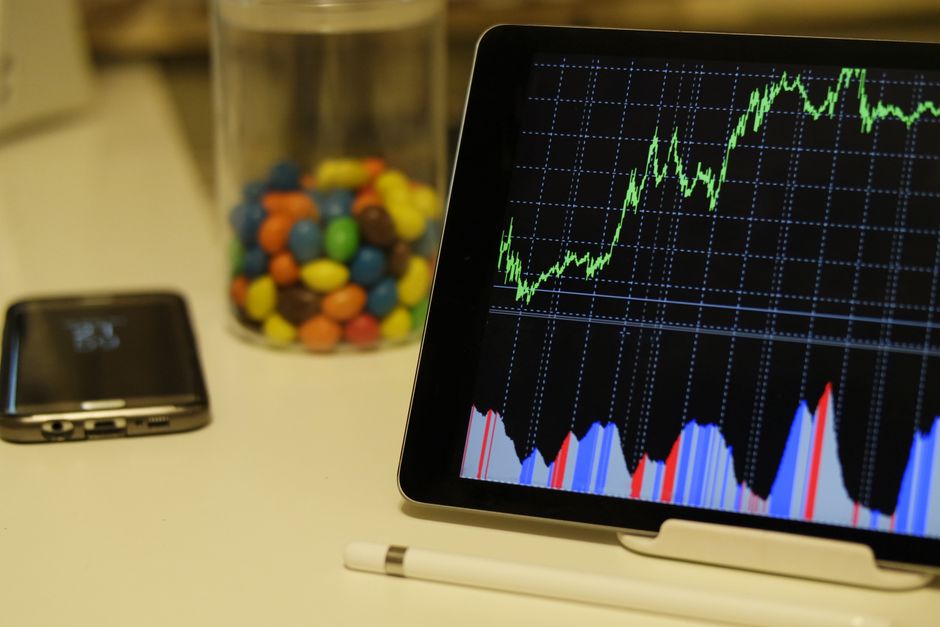 Market-monitoring tablet displaying financial data and stock trends