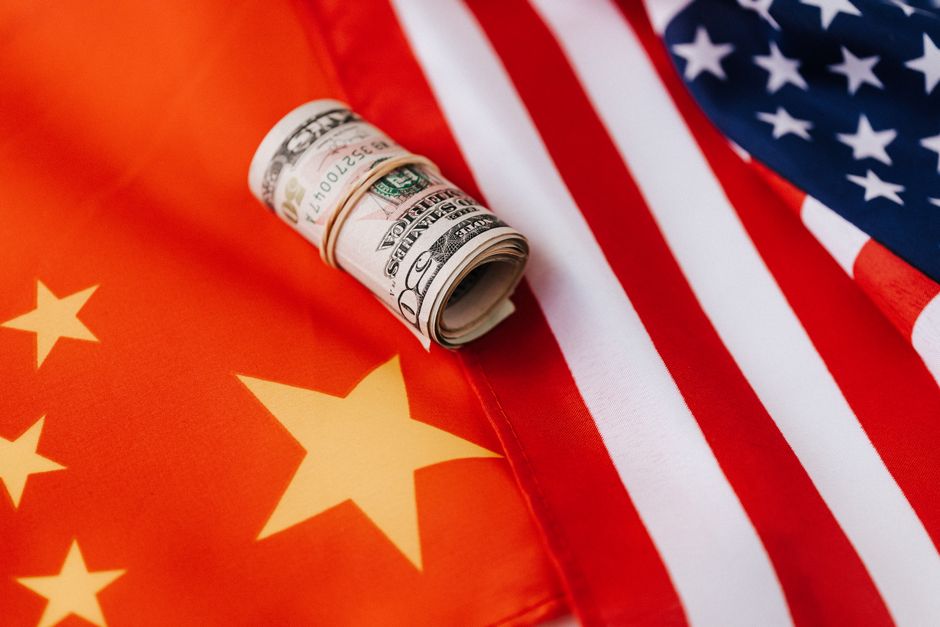 Roll of dollar bills on an American flag