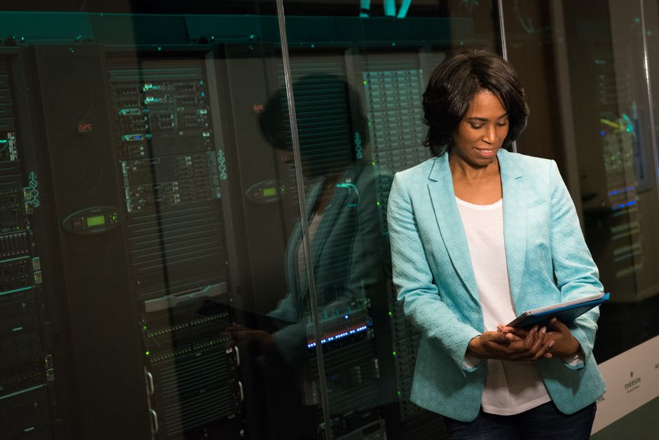 An IT professional reviews data in a modern server environment as enterprise workloads become more complex.
